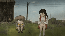 a boy and a girl are sitting in the grass looking at each other