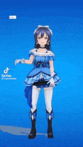 a girl in a blue dress is standing on a blue background .