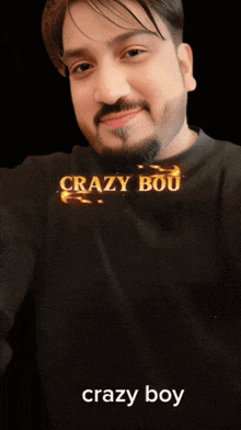 a man with a beard is wearing a black shirt and the word crazy boy is on the bottom