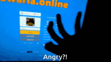 a person 's hand is visible in front of a screen that says angry on it