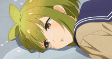 a girl with green hair is crying with a tear running down her face