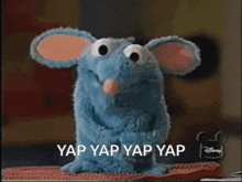 a stuffed animal with its mouth open and the words yap yap yap yap