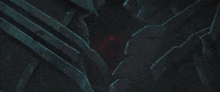 a dark room with a red light coming out of the corner
