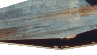 a close up of a piece of wood that looks like a skateboard