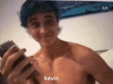 a shirtless man taking a selfie with the name kevin written on the bottom