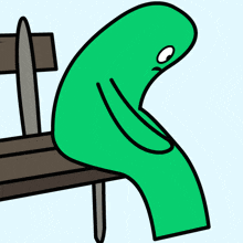 a green cartoon character laying on a bench