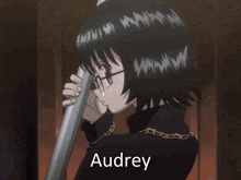 a girl with glasses and the name audrey on it