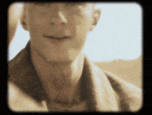 a close up of a man 's face and neck