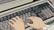 a person is typing on a keyboard that says ' mc ' on it