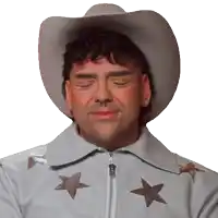 a man with his eyes closed wearing a cowboy hat