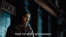 a yellow car with the words yeah i 'm afraid of americans written below it