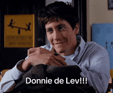 a man with a backpack on his lap says donnie de lev