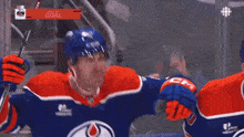 a hockey player with the word oilers on his shirt