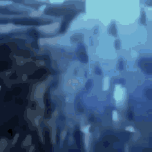 a blurry picture of a body of water with bubbles coming out of it