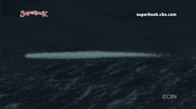 an advertisement for superbook.cbn.com with a stormy ocean in the background