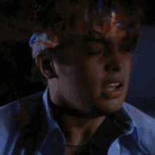 a close up of a man wearing a headband