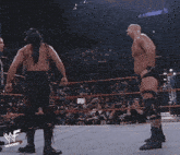 wrestlers in a ring with the word memories on the bottom right