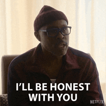 a man wearing a beanie and glasses says i 'll be honest with you