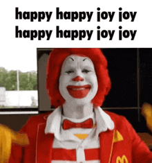 mcdonald 's ronald mcdonald is wearing a red and white striped suit and bow tie and is smiling .