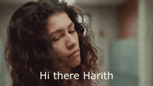 a close up of a woman 's face with the words `` hi there harith '' written above her .