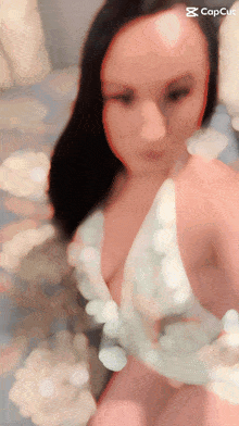 a blurred image of a woman with a caption that says cap cut