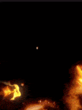 a close up of a fire in the dark