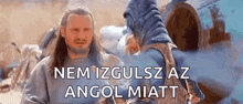 a man with long hair and a beard is talking to another man in a movie .