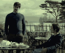 The Lobster Movie Colin Farrell GIF - The Lobster Movie Colin Farrell Sitting At An Outdoor Cafe GIFs
