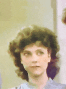 a painting of a woman with curly hair and a serious look on her face