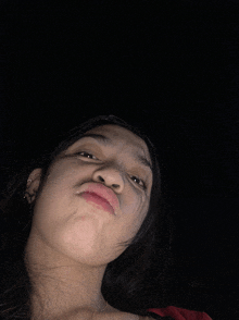 a woman making a face with her mouth open