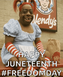 a wendy 's sign is behind a person dressed as wendy 's