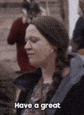 a woman says " have a great " in front of her