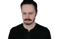 a man with a beard and mustache is making a funny face