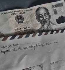 an envelope with a 500000 vietnamese banknote on it