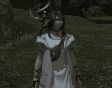 a woman in a white dress and glasses is standing in a field