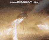 a rocket is flying through the air in a smokey area .