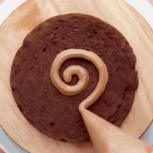 a chocolate cake with a spiral design on it