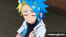 a boy with blue hair and a white shirt is sitting on a wooden floor with his eyes closed .