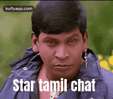 a man in a blue jacket with the words star tamil chat written on his face