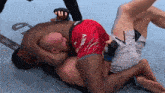 a man in a red shorts that says ' ivey ' on it