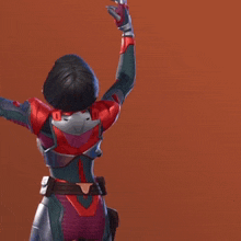 a woman in a superhero costume is standing with her arms in the air