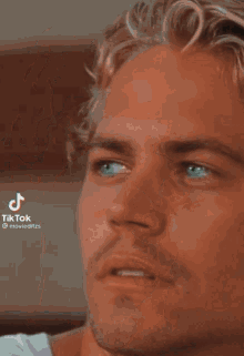 a close up of a man 's face with a tik tok watermark
