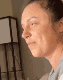 a close up of a woman 's face without makeup