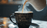 a cup that says goth morning is being poured into