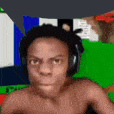 a man wearing headphones is making a funny face .