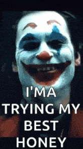 the joker is smiling and saying `` i 'm a trying my best honey '' .
