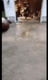 a blurred image of a garage door with a green sign that says ' a ' on it