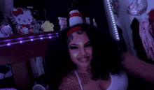 a woman taking a selfie in front of a mirror with a hello kitty on it