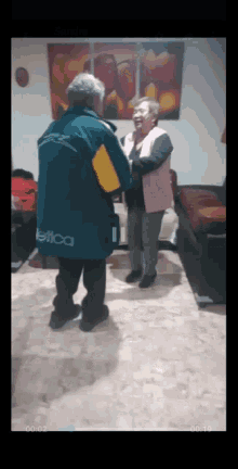 a man wearing a jacket that says nautica on it