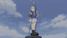 a girl in a blue jacket is holding a fan